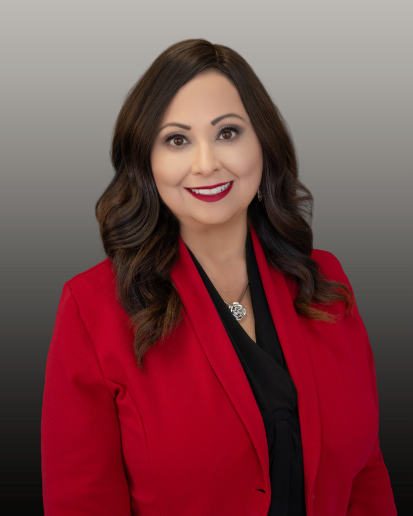 Professional headshot of woman in red blazer