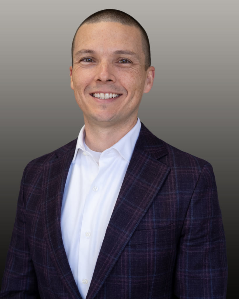 Smiling man in plaid suit jacket portrait