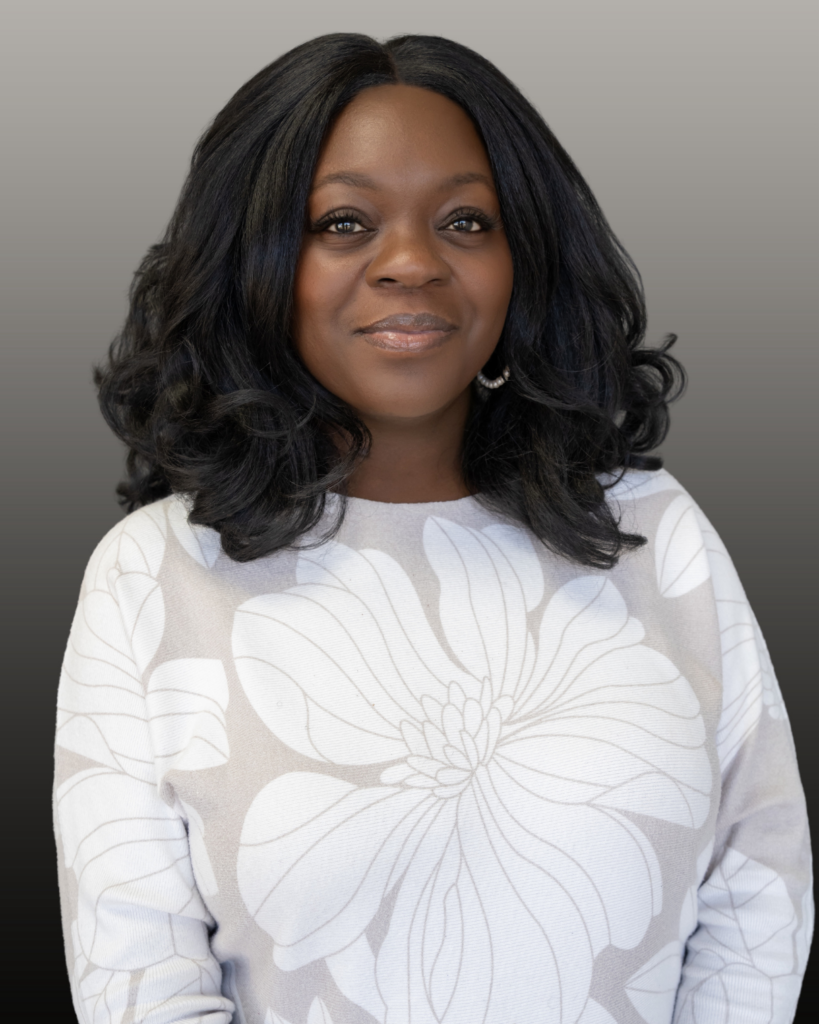 Smiling woman in white floral blouse
