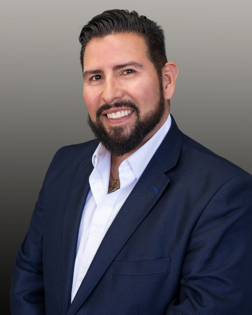 Smiling bearded man in navy suit