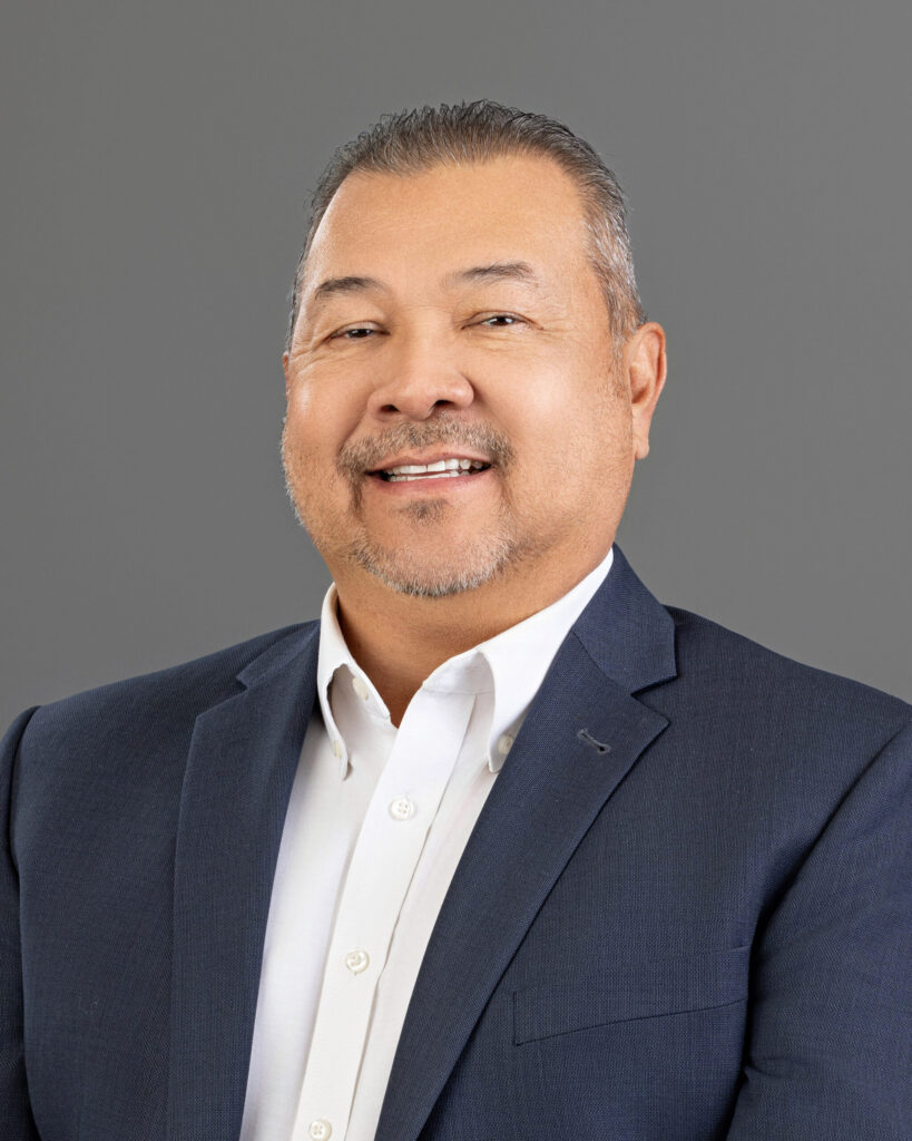 Smiling man in blazer and white shirt