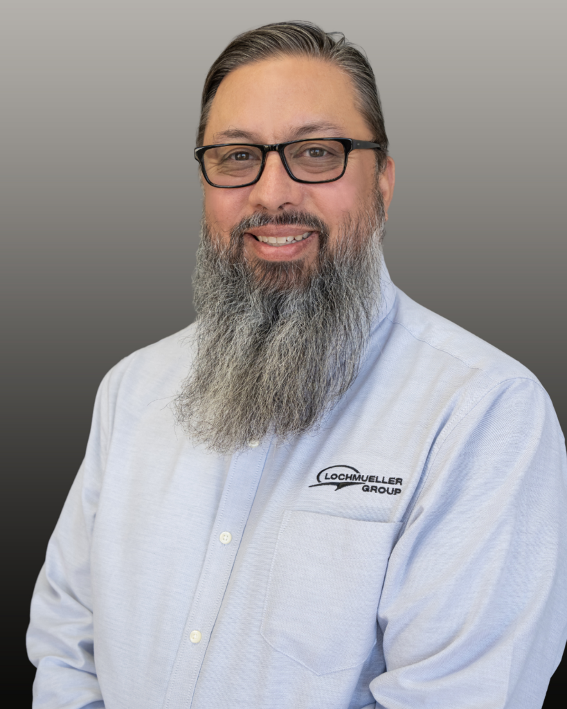 Smiling bearded man with glasses, company shirt
