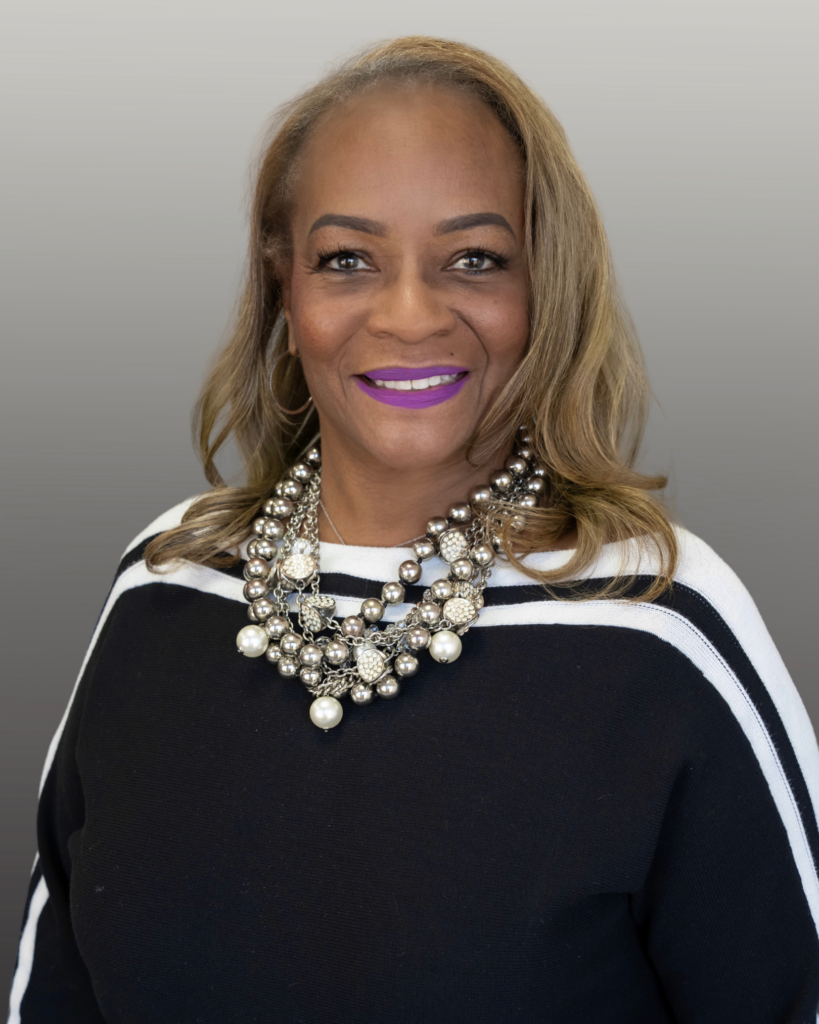 Smiling woman wearing statement pearl necklace