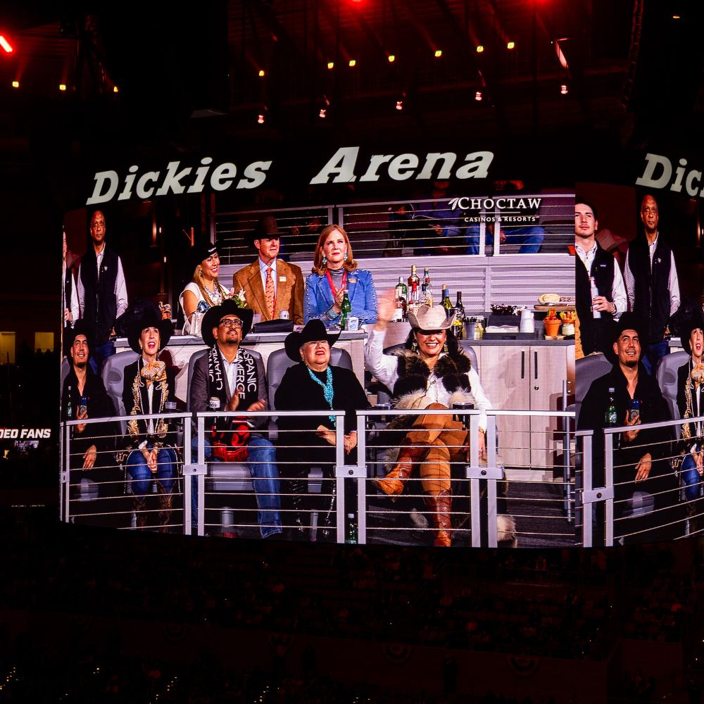 Group of people shown on Dickies Arena screen