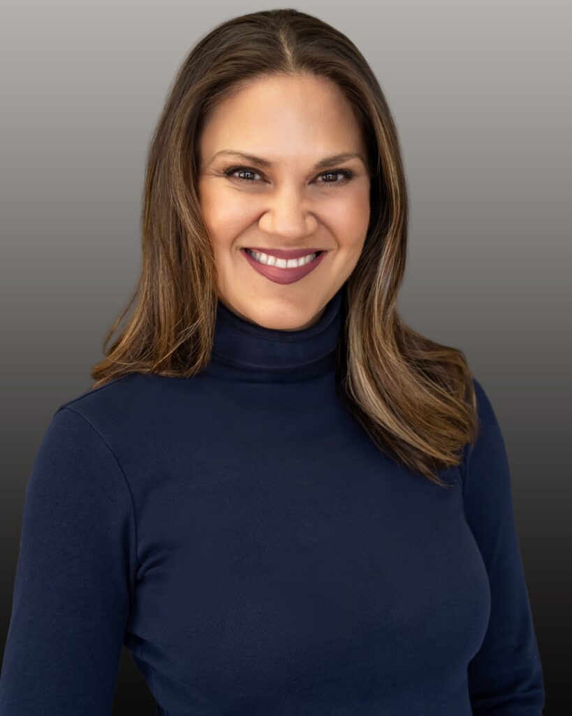 Smiling woman in navy turtleneck portrait
