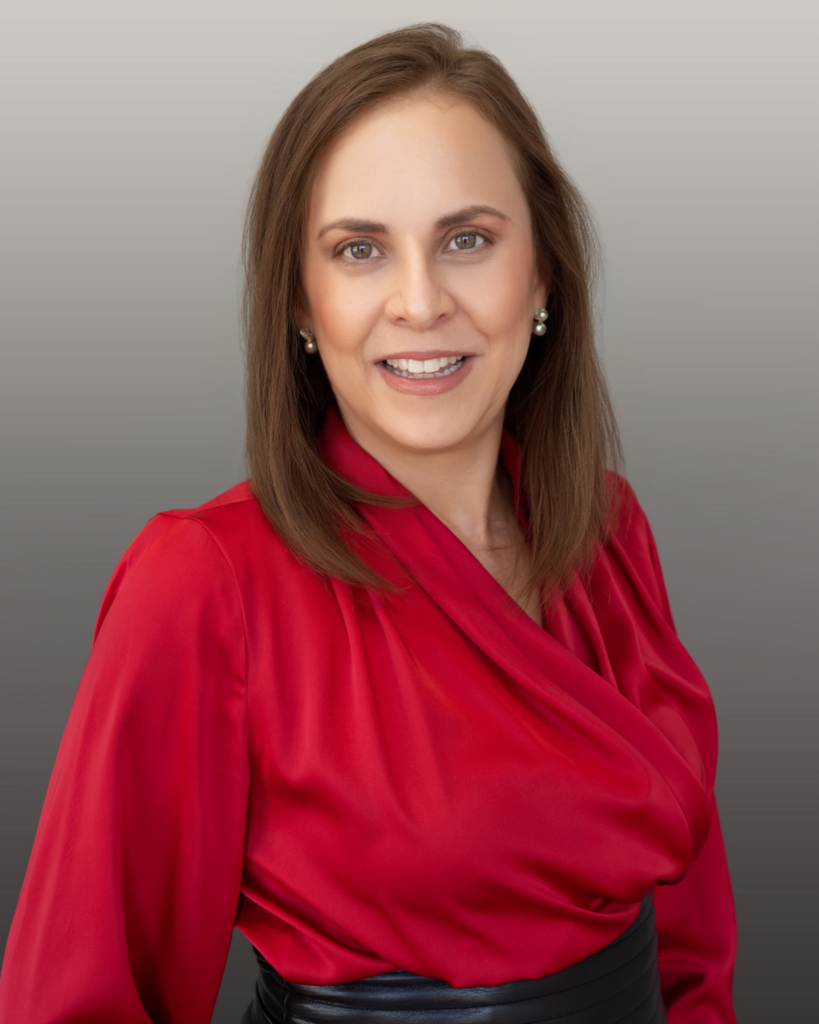 Portrait of smiling woman in red blouse