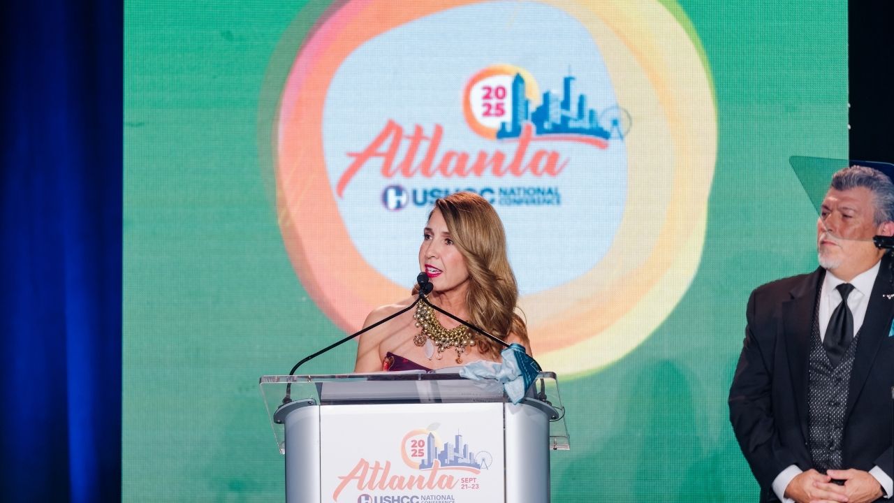 Woman speaking at Atlanta conference podium
