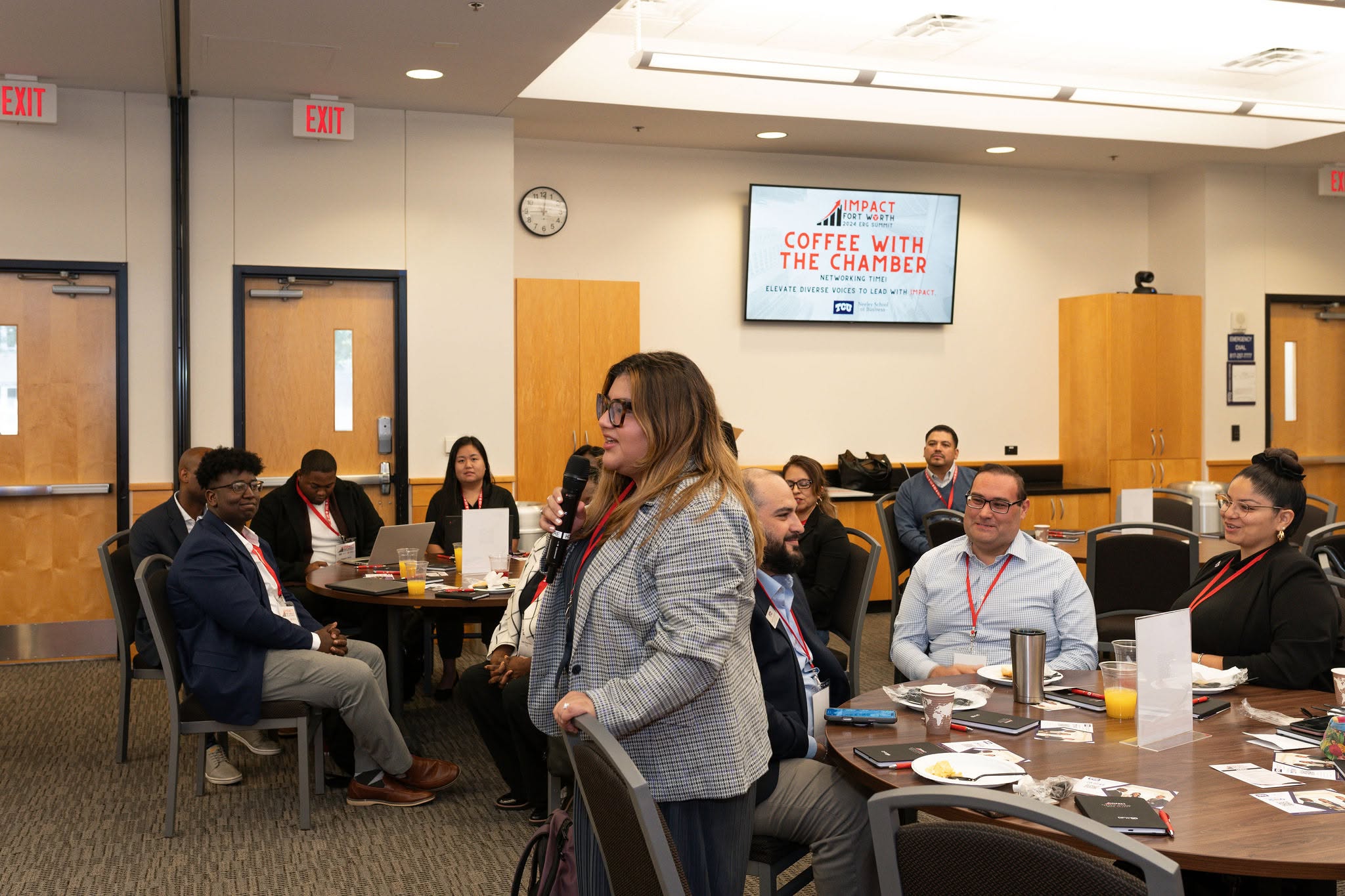 Woman speaking at chamber coffee networking event