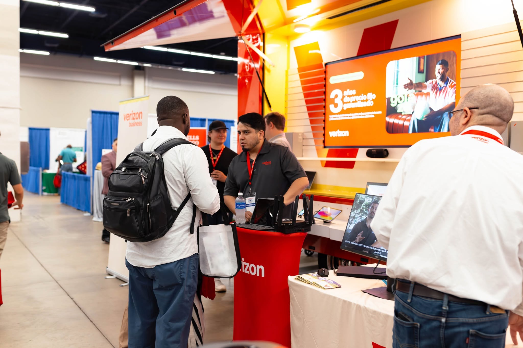 Attendees at Verizon trade show booth